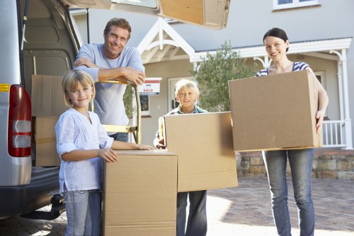 Moving boxes and furniture in a Hackney flat with narrow access