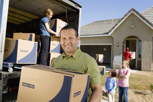 Packed boxes and furniture stored securely in a Hackney self storage unit